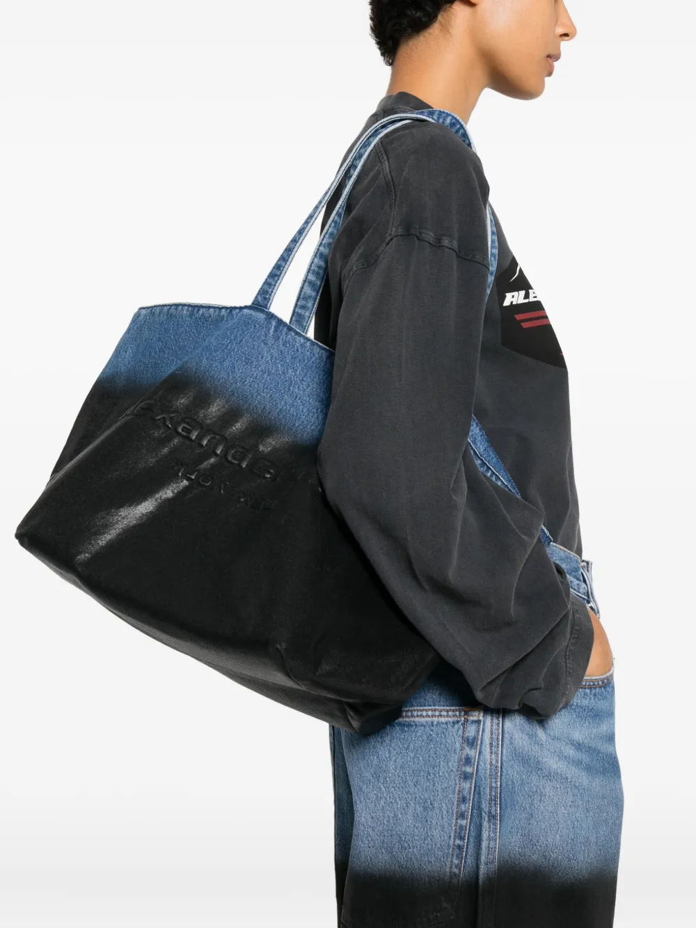 Black bag worn by a person, showing the bag fit