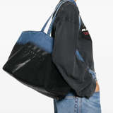 Black bag worn by a person, showing the bag fit