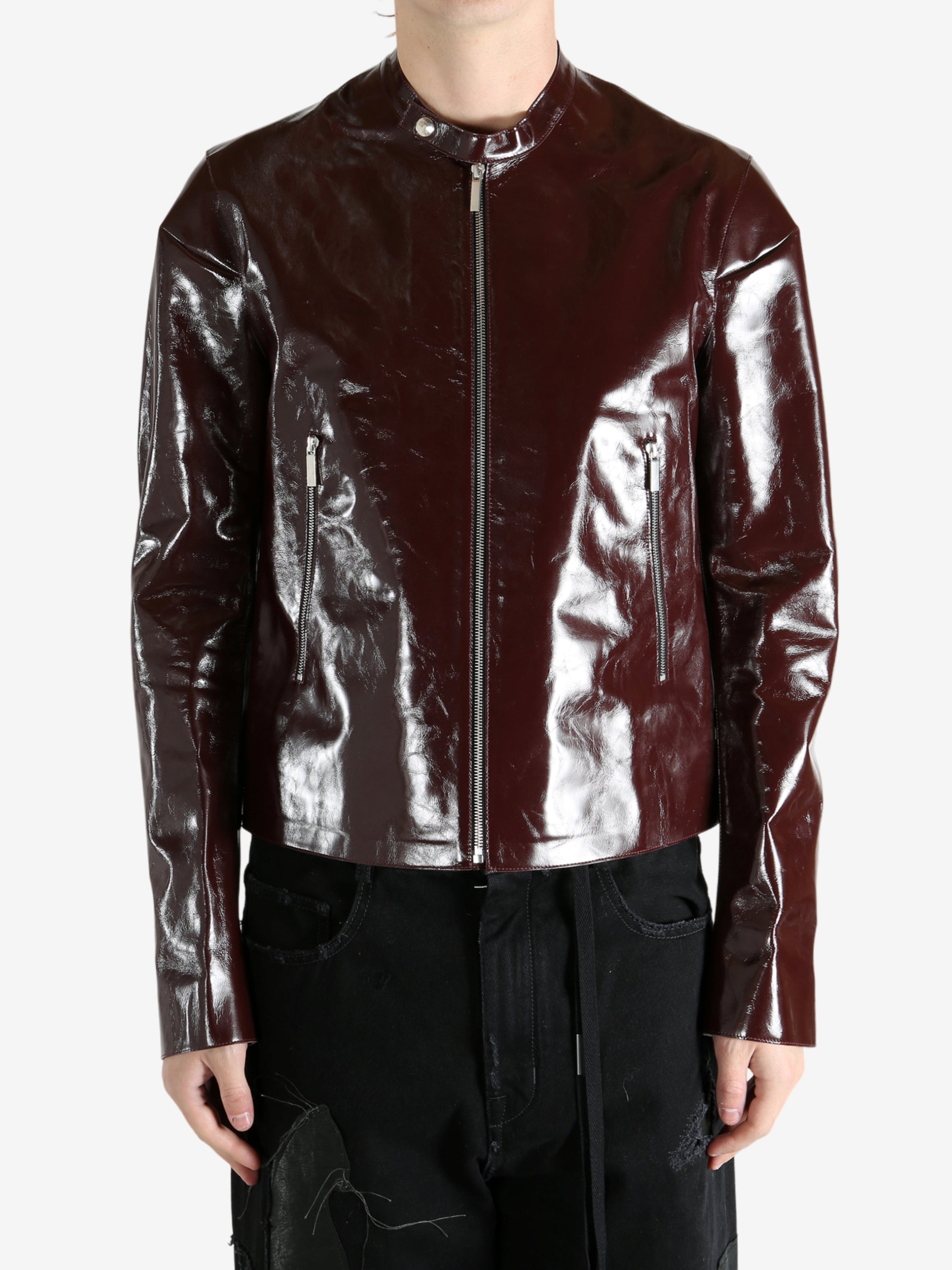 Burgundy jacket worn by a person, showing the jacket's fit