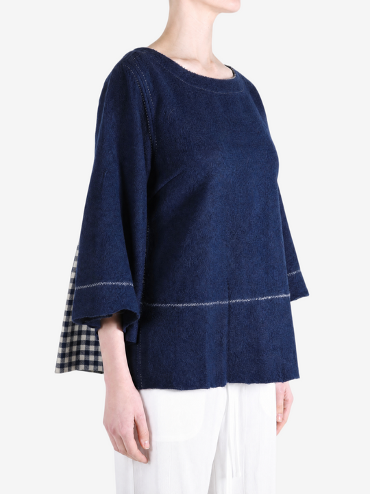 Navy top worn by a person, showing the top fit
