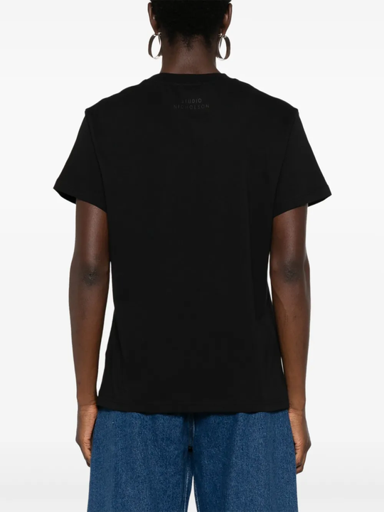 Black t-shirt worn by a person, showing the shirt fit