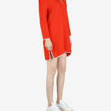 Orange dresses worn by a person, showing the dress's fit