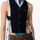 Blue cardigan worn by a person, showing the cardigan's fit