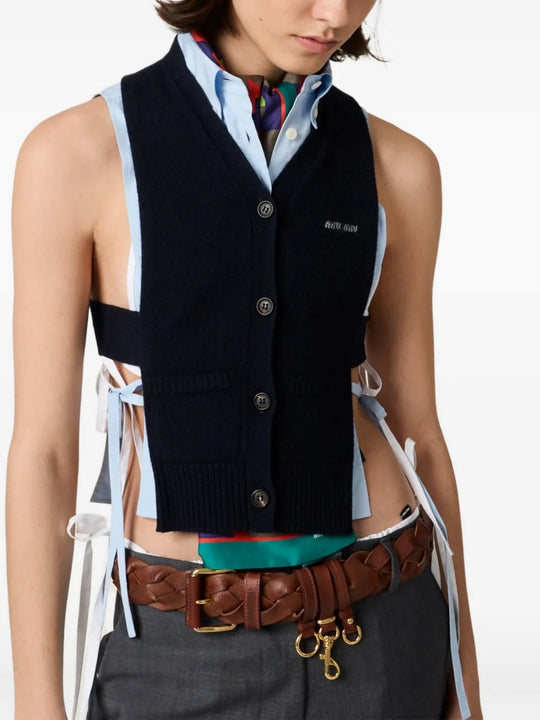 Blue cardigan worn by a person, showing the cardigan's fit