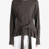 Brown top worn by a person, showing the top fit
