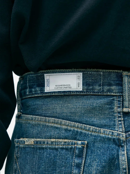 Close up of blue pants, showing texture of the cotton fabric