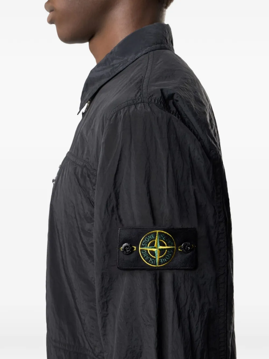 Close up of the black jacket, showing texture of the polyamide fabric