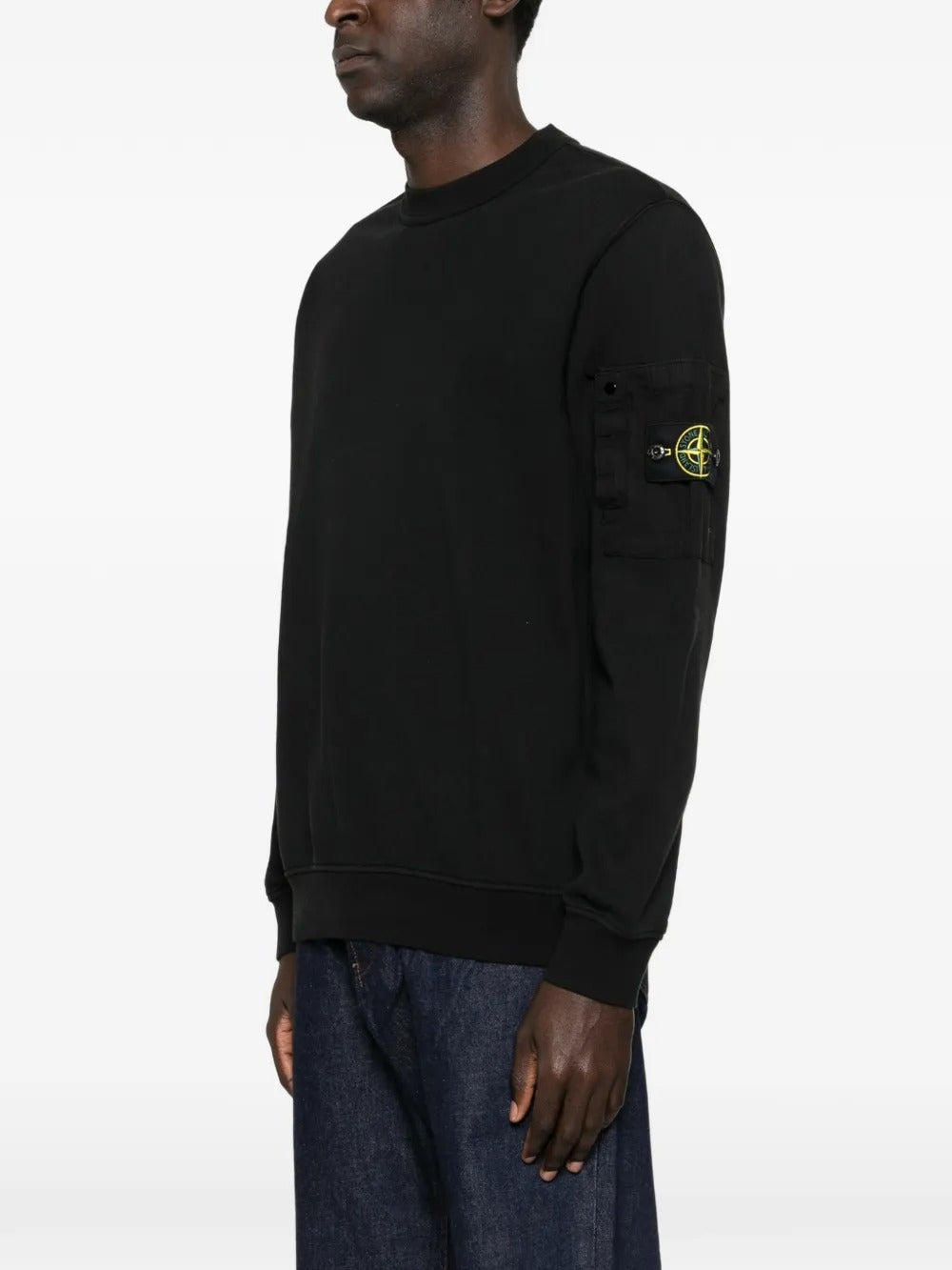 Black sweatshirt worn by a person, showing the sweatshirt fit
