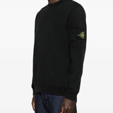 Black sweatshirt worn by a person, showing the sweatshirt fit