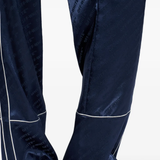 Black sneaker worn by a person, showing the sneaker's fit