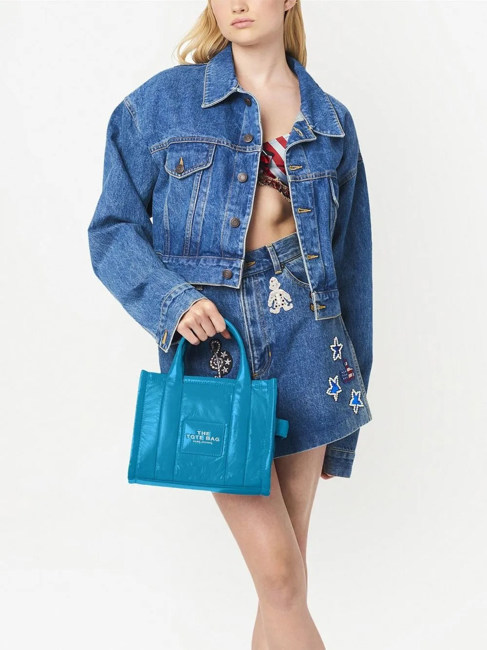 Blue bag carried by a person, showing the bag's fit