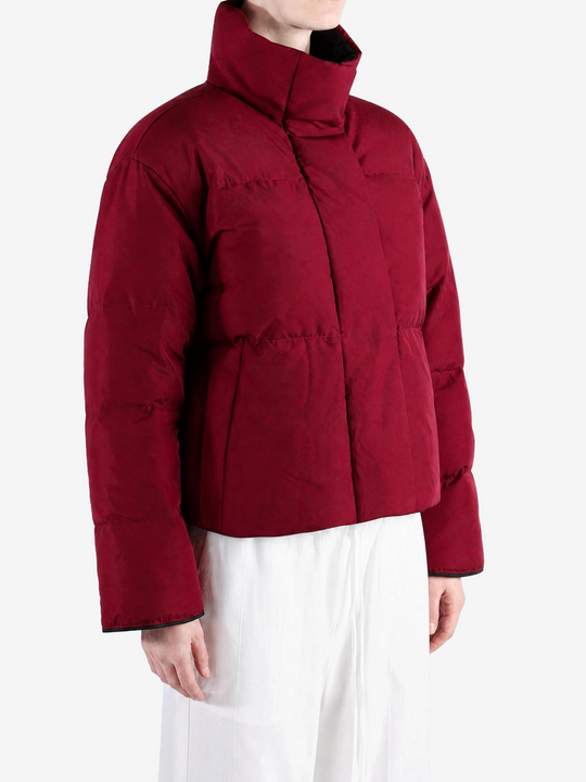 Burgundy jacket worn by a person, showing the jacket fit