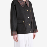 Black jacket worn by a person, showing the jacket fit