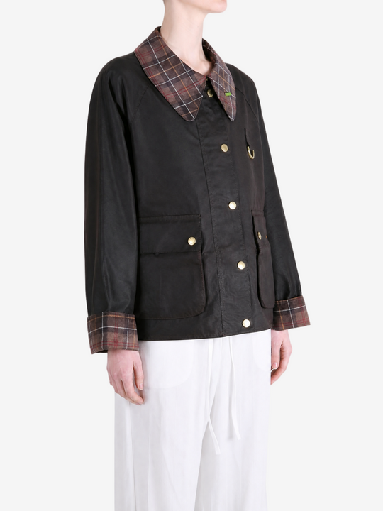Black jacket worn by a person, showing the jacket fit