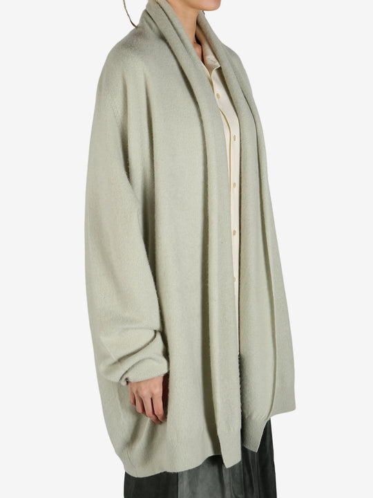 Green cardigan worn by a person, showing the cardigan fit