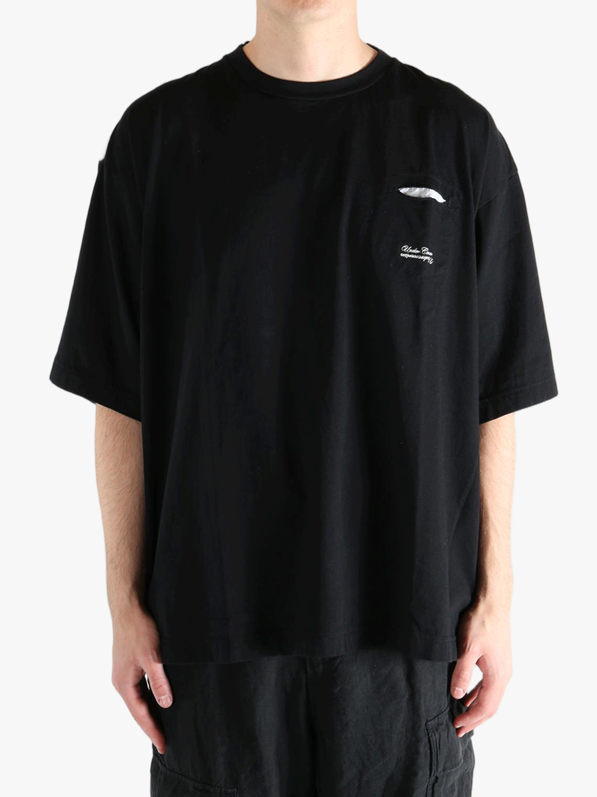 Black t-shirt worn by a person, showing the shirt's fit