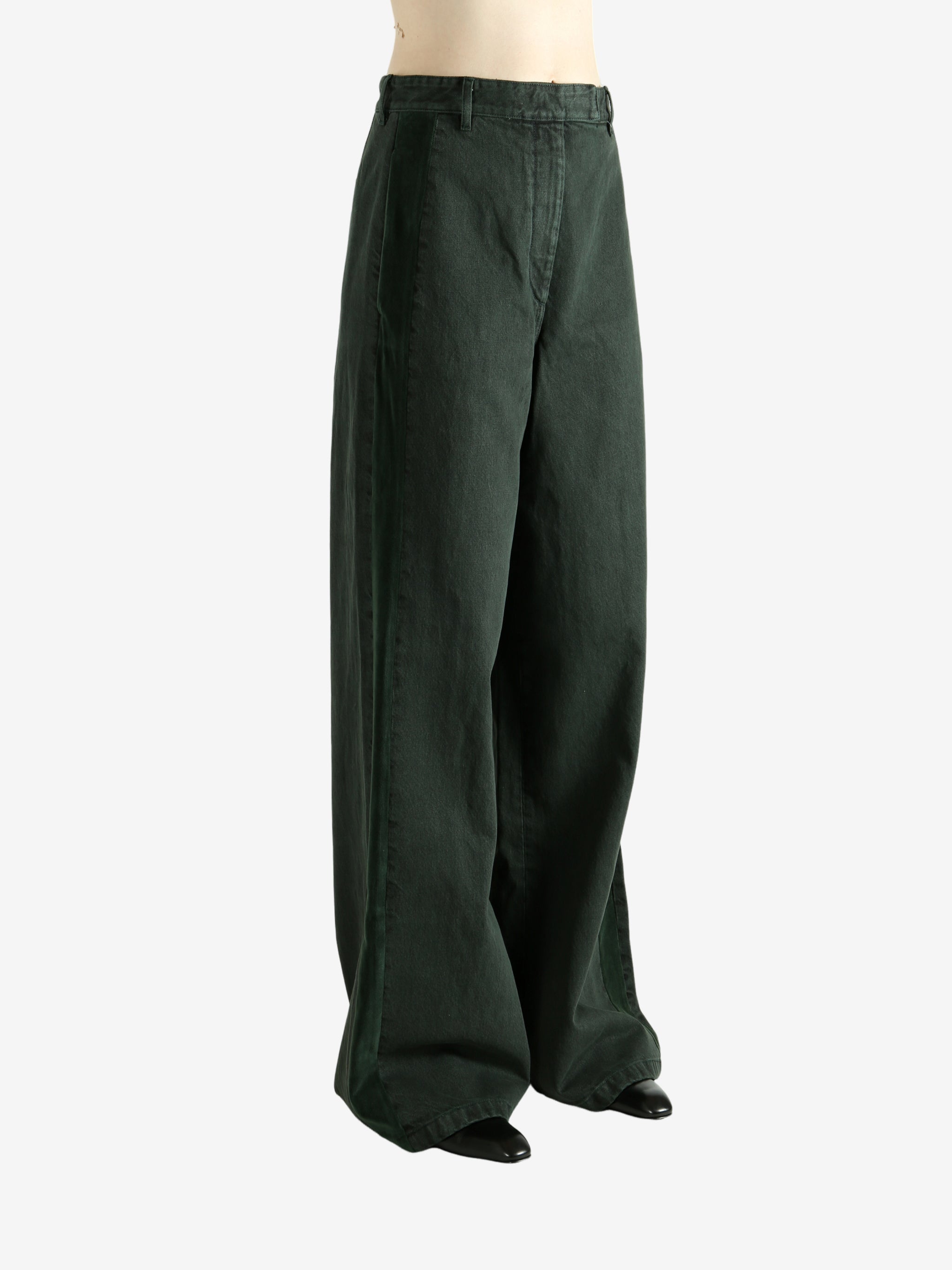 Green pants worn by a person, showing the pants's fit