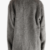 Grey cardigan worn by a person, showing the cardigan's fit