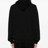 Black hoodies worn by a person, showing the hoodies fit