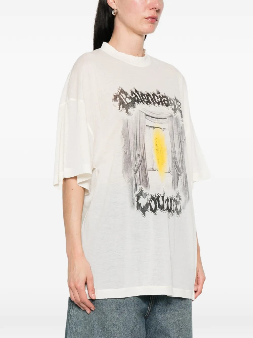 White t-shirt worn by a person, showing the t-shirt's fit