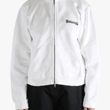 White hoodie worn by a person, showing the shirt's fit