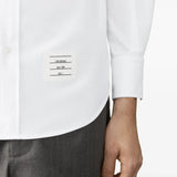 White shirt worn by a person, showing the shirt fit