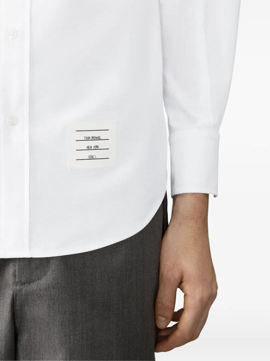 White shirt worn by a person, showing the shirt fit