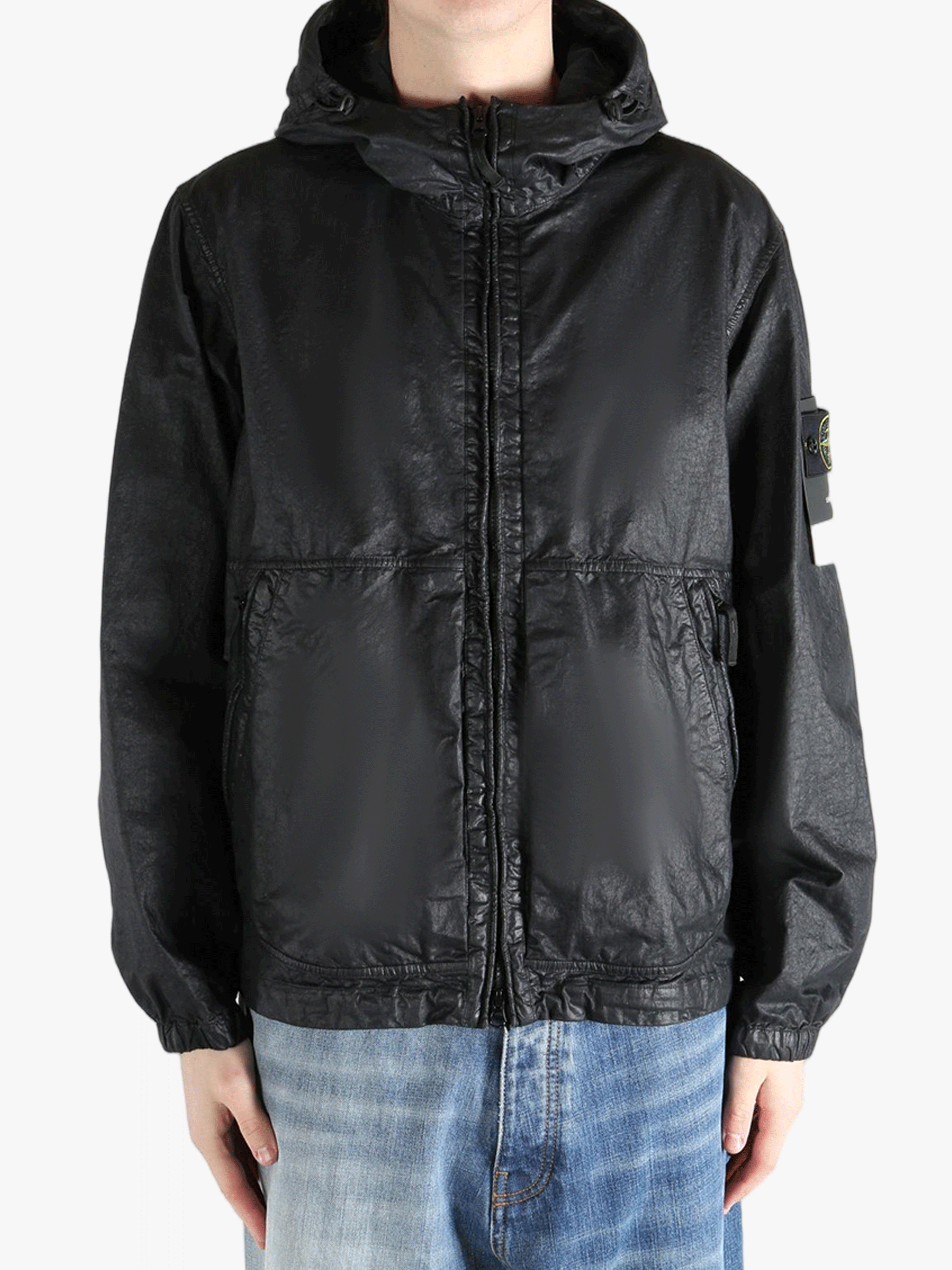 Black jacket worn by a person, showing the jacket fit