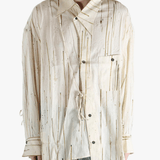 Tan shirt worn by a person, showing the shirt's fit