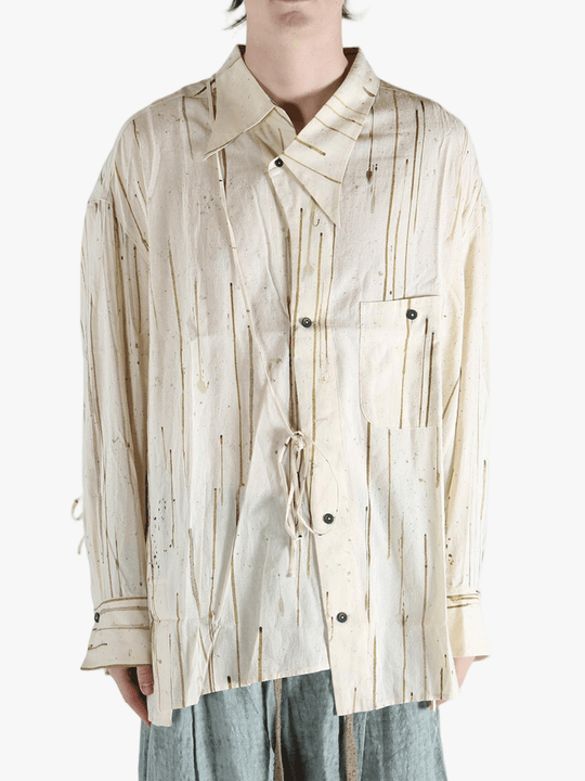 Tan shirt worn by a person, showing the shirt's fit