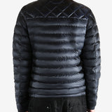 Black jacket worn by a person, showing the jacket fit