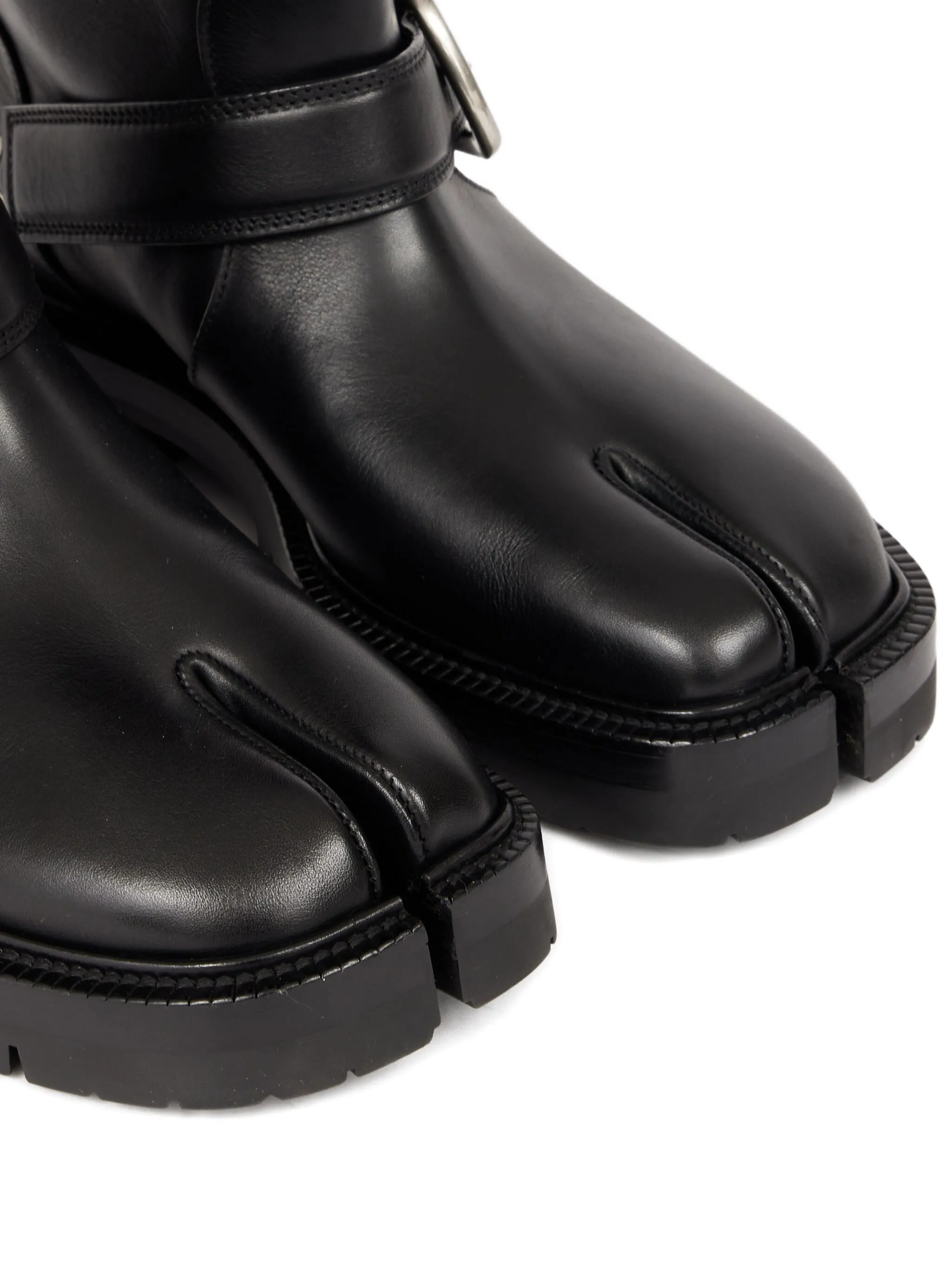 Close up of black boots showing texture of the leather fabric