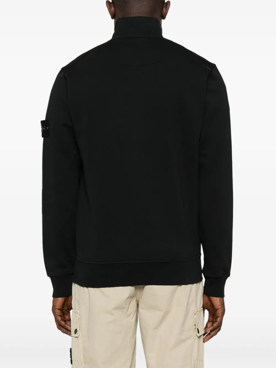 Black jacket worn by a person, showing the jacket fit