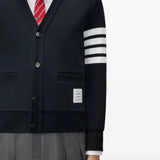 Navy knitwear worn by a person, showing the knitwear fit