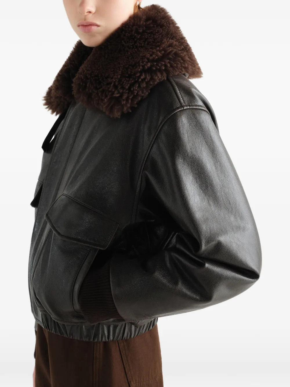 Black jacket worn by a person, showing the jacket fit