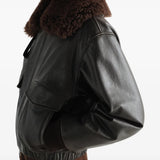 Black jacket worn by a person, showing the jacket fit