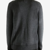 Grey knitwear worn by a person, showing the knitwear's fit