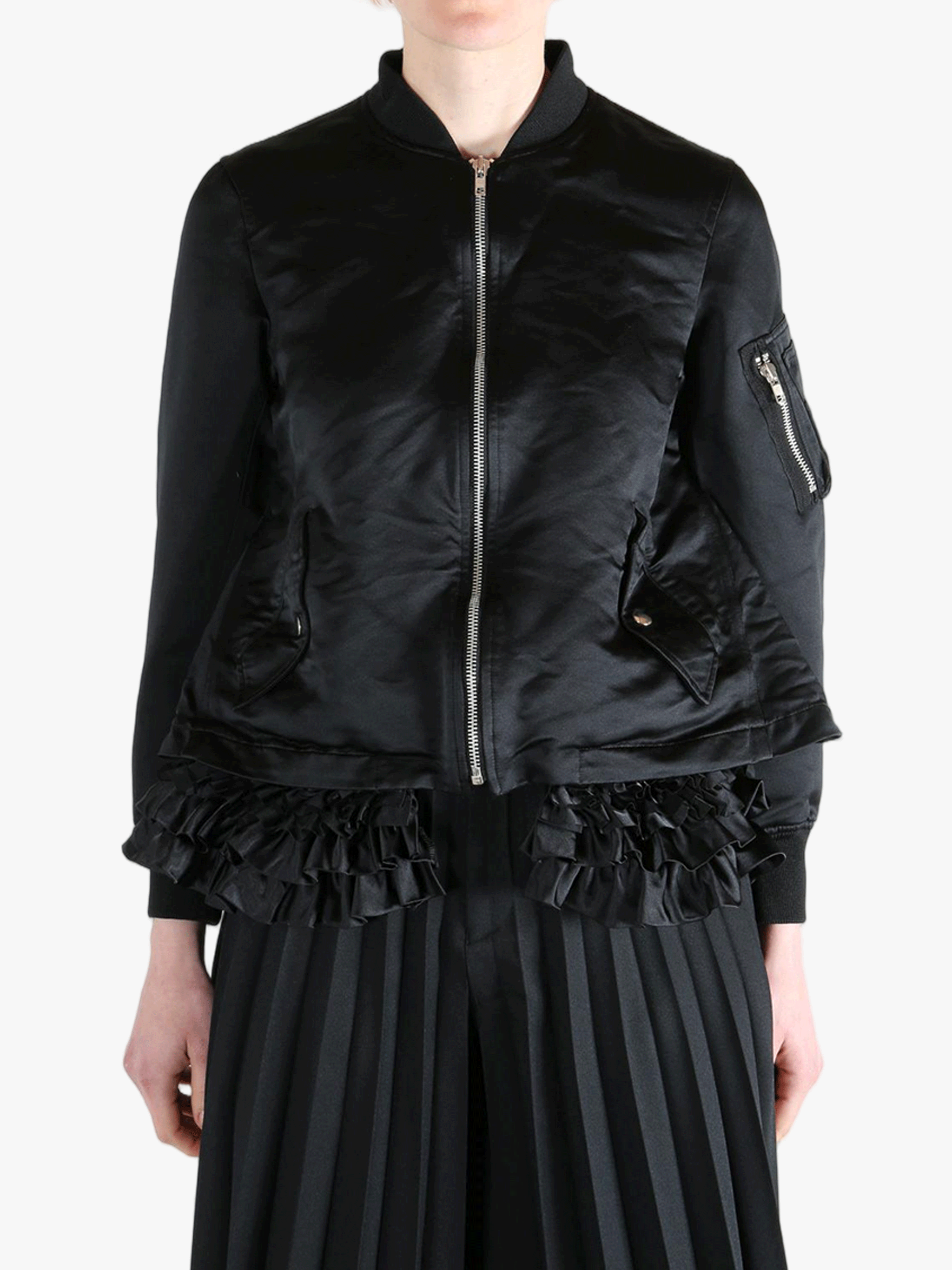 Black jacket worn by a person, showing the jacket's fit