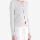White knitwear worn by a person, showing the knitwear fit