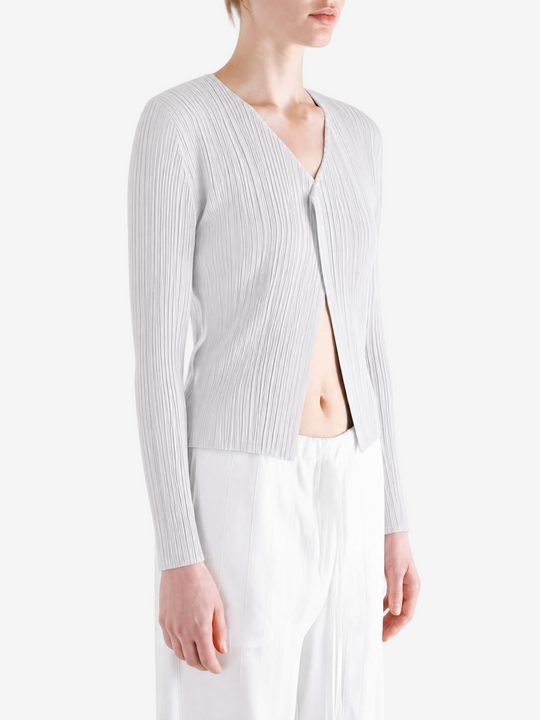 White knitwear worn by a person, showing the knitwear fit