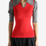 Red knitwear worn by a person, showing the knitwear's fit