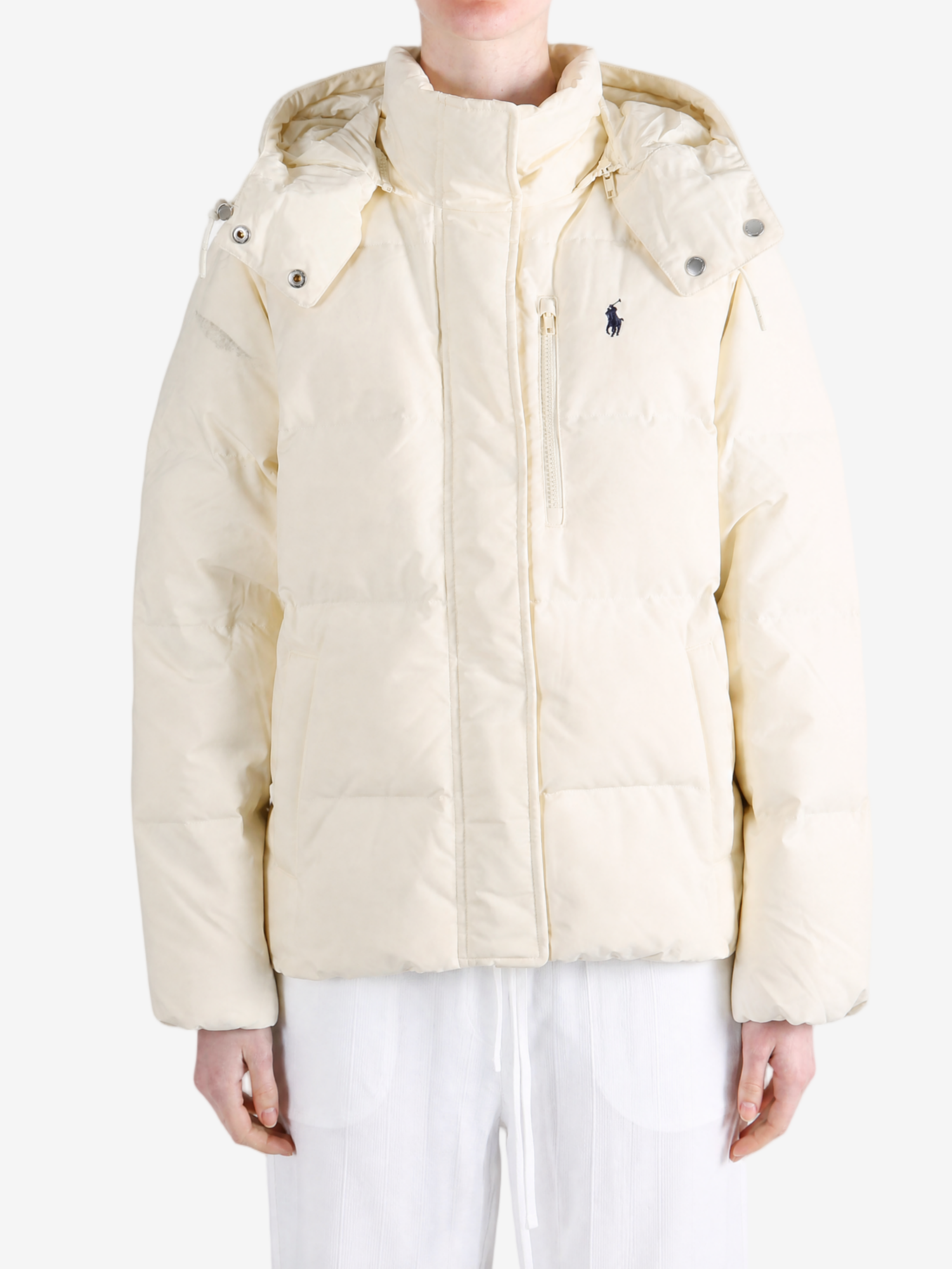 Tan jacket worn by a person, showing the jacket fit