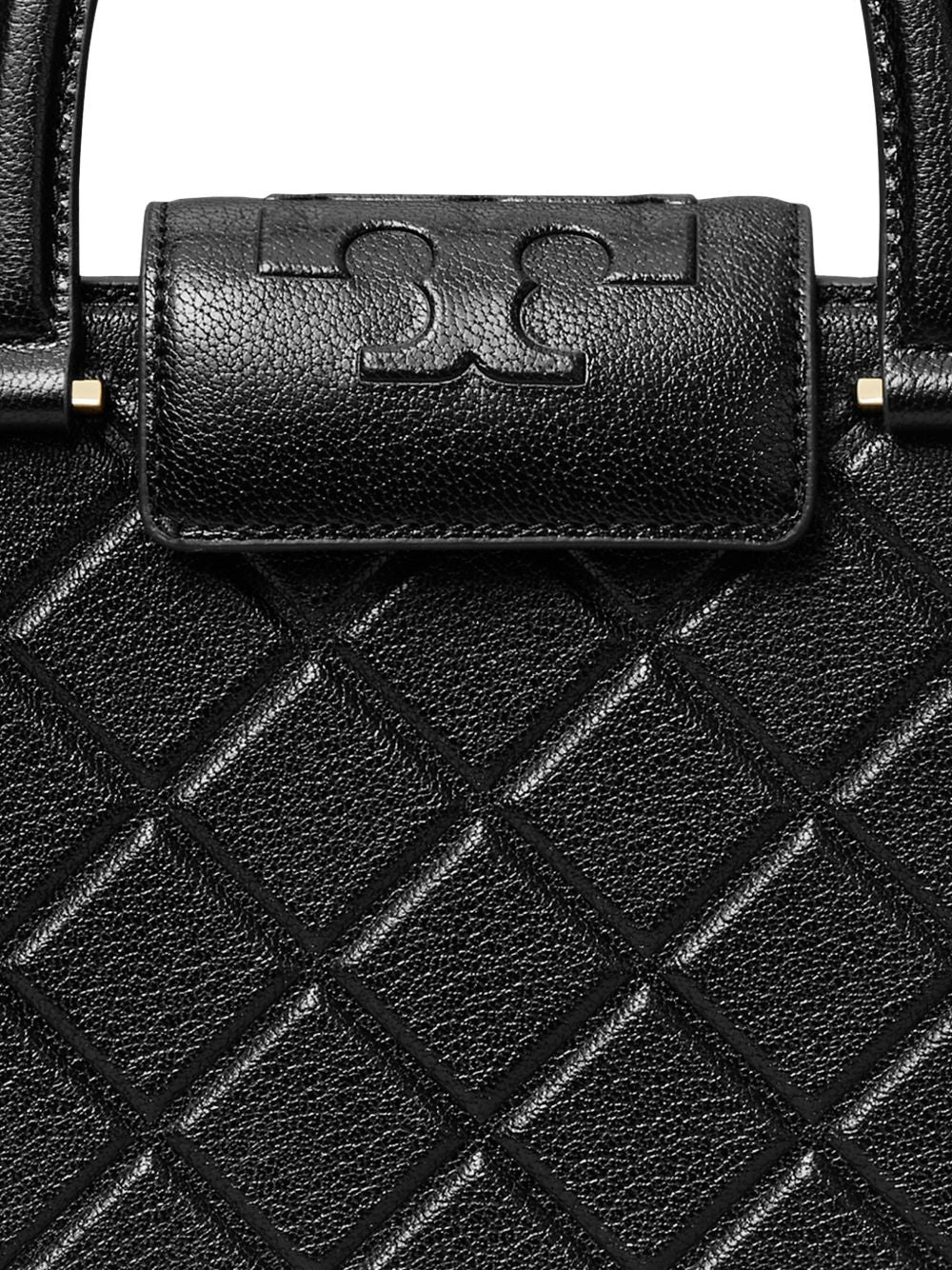 Close up of black bag, showing texture of the leather fabric