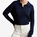 Navy knitwear worn by a person, showing the knitwear fit
