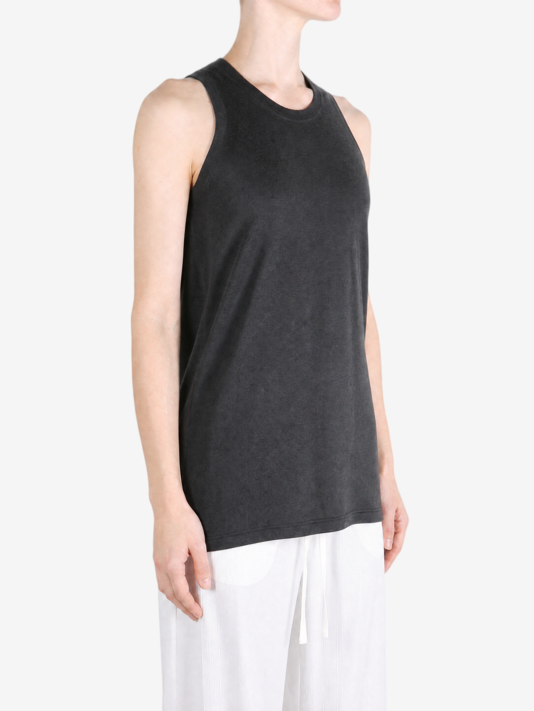 Black top worn by a person, showing the top fit