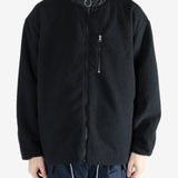 Black jacket worn by a person, showing the jacket's fit