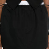 Close up black skirt, showing texture of the cotton fabric