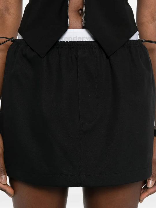 Close up black skirt, showing texture of the cotton fabric