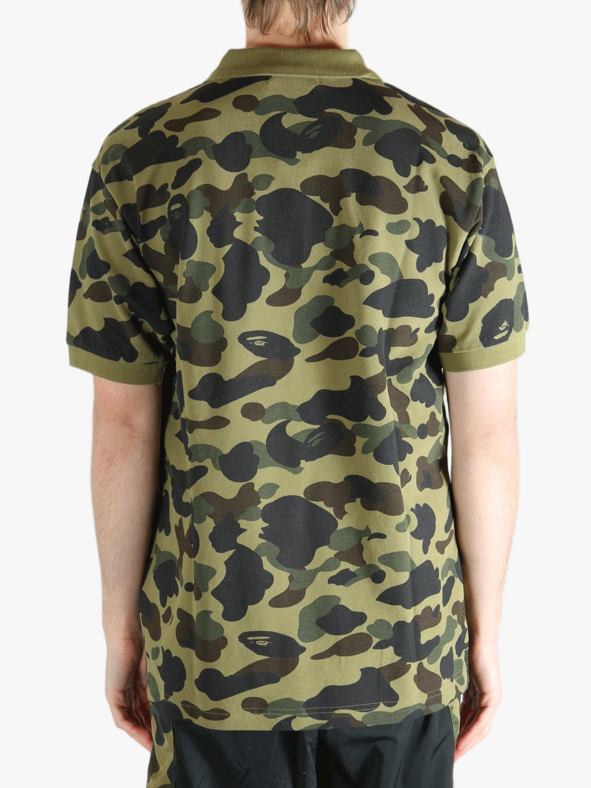 Green shirt worn by a person, showing the shit fit
