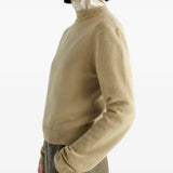 Tan hoodie worn by a person, showing the hoodie fit